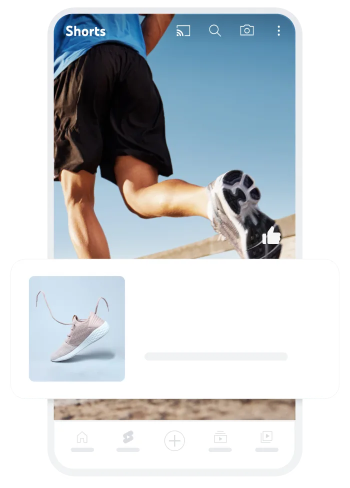 YouTube ShortsフィードでのデマンドジェネレーションGoogle広告の表示イメージ。縦型動画の下部に商品カードとリンクが表示されている